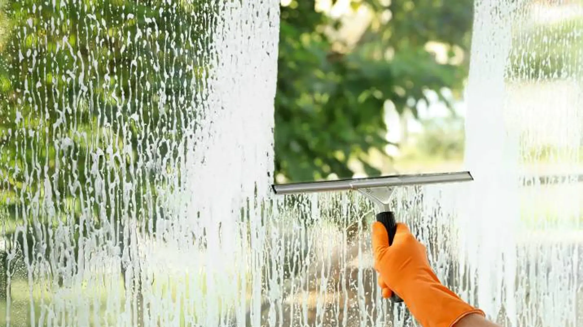 1675763019447-squeegee-cleaning-window-indoors